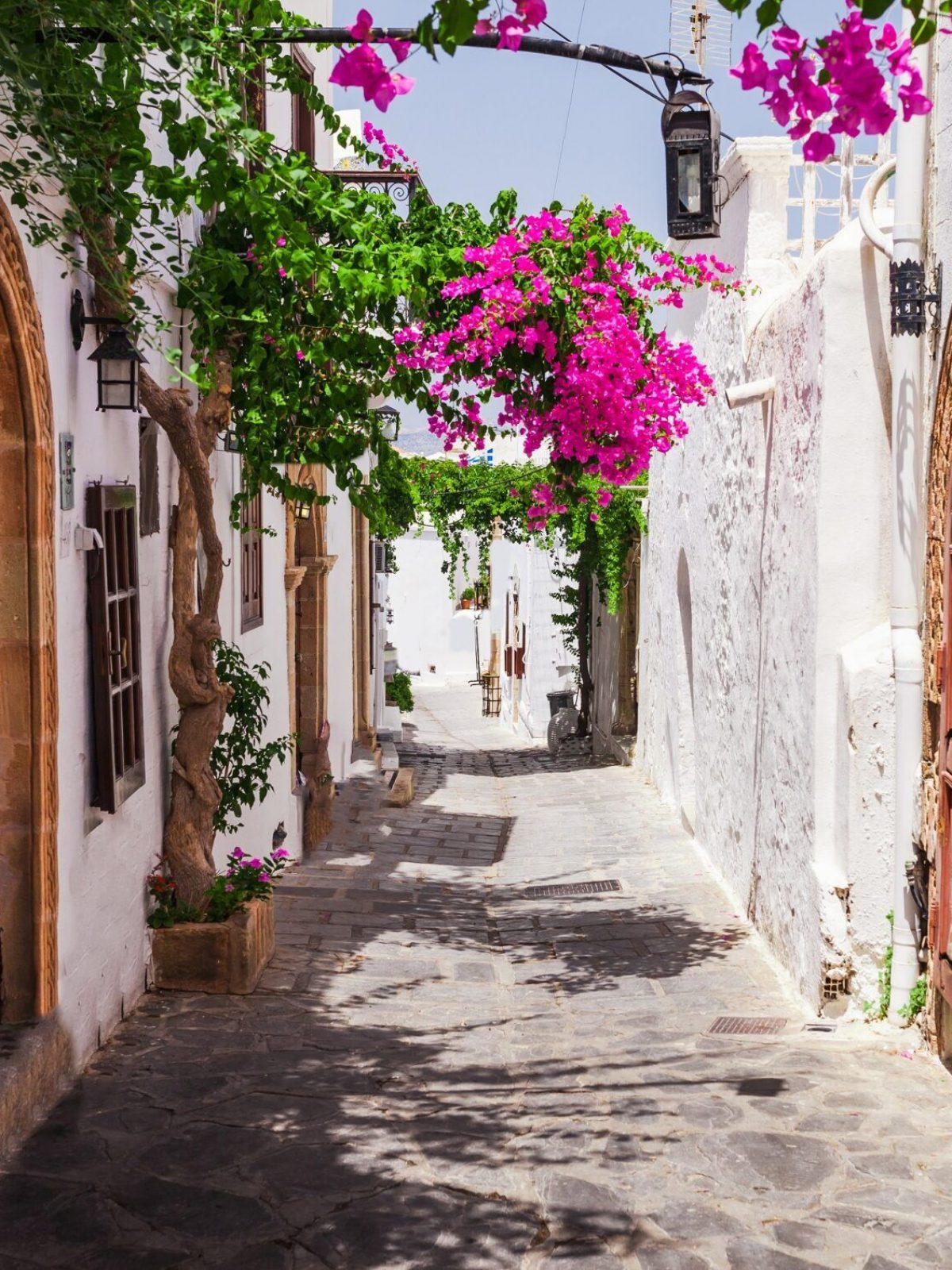 Narrow,Street,In,Lindos,Town,On,Rhodes,Island,,Dodecanese,,Greece.